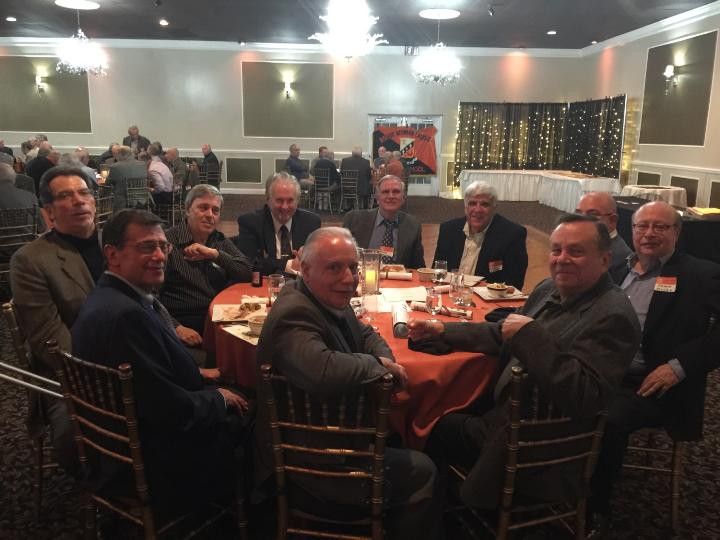 Several members of the Bishop Neumann Class of 1967 seated at a table.