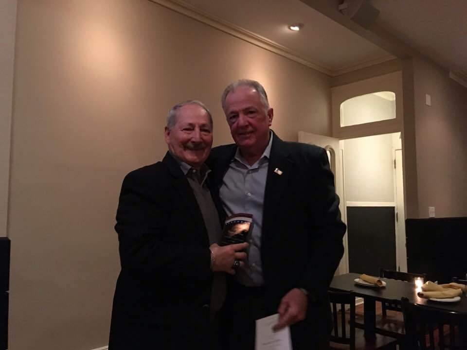 Billy Latta '70 (right) presenting the Veterans Alumni 2017 Man of the Year award to Pasquale 'Pat' DiPilla '65 (left).